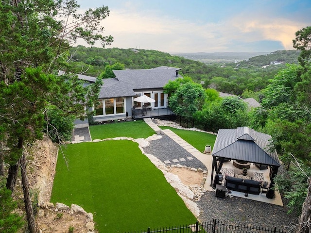 20702 Post Oak Dr, Lago Vista, TX 78645 - back of house featuring a gazebo, a view of trees, a patio, an outdoor living space, and a deck