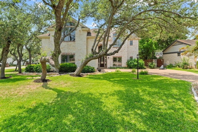 205 Champion Dr, Lakeway, TX 78734 - view of front facade with stone siding and stucco siding