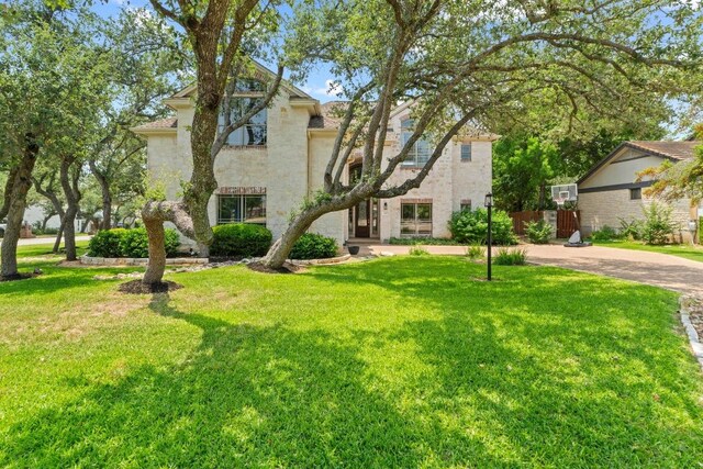 205 Champion Dr, Lakeway, TX 78734 - view of front of property featuring stone siding and stucco siding
