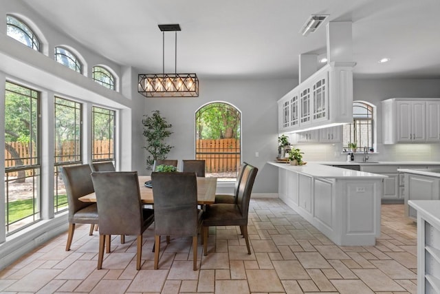 205 Champion Dr, Lakeway, TX 78734 - dining space with recessed lighting and light stone finish flooring