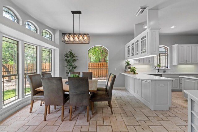 205 Champion Dr, Lakeway, TX 78734 - dining area with recessed lighting and light stone finish floors
