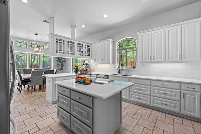 205 Champion Dr, Lakeway, TX 78734 - kitchen featuring gray cabinets, appliances with stainless steel finishes, a center island, recessed lighting, and white cabinetry