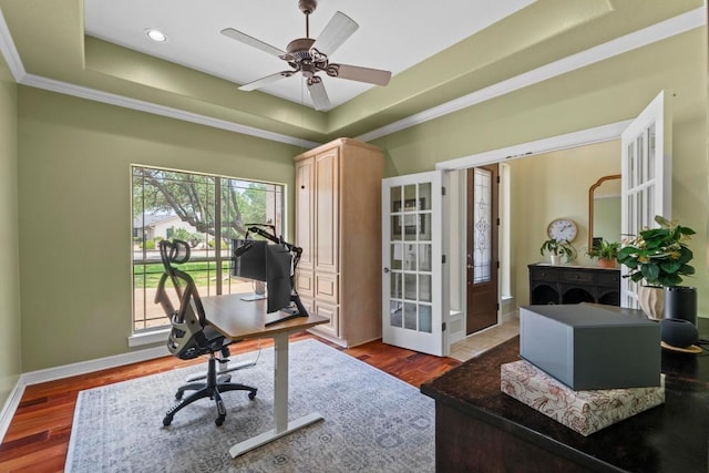 205 Champion Dr, Lakeway, TX 78734 - home office with french doors, a tray ceiling, ornamental molding, dark wood-style flooring, and a ceiling fan