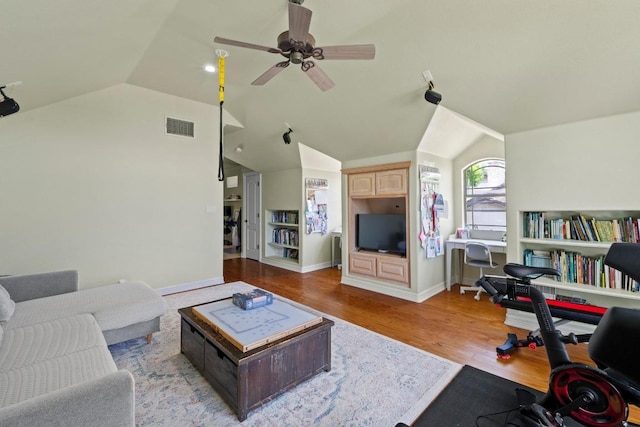 205 Champion Dr, Lakeway, TX 78734 - living area featuring lofted ceiling, a ceiling fan, and wood finished floors