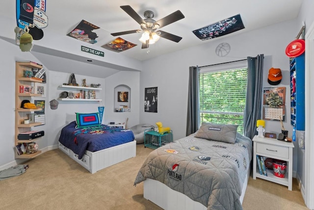 205 Champion Dr, Lakeway, TX 78734 - carpeted bedroom featuring a ceiling fan and baseboards