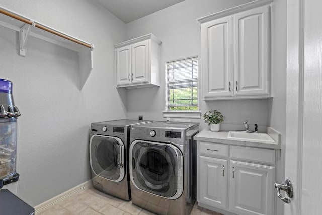205 Champion Dr, Lakeway, TX 78734 - laundry room featuring cabinet space and washer and clothes dryer
