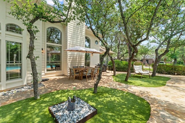 205 Champion Dr, Lakeway, TX 78734 - view of grassy yard with a patio area
