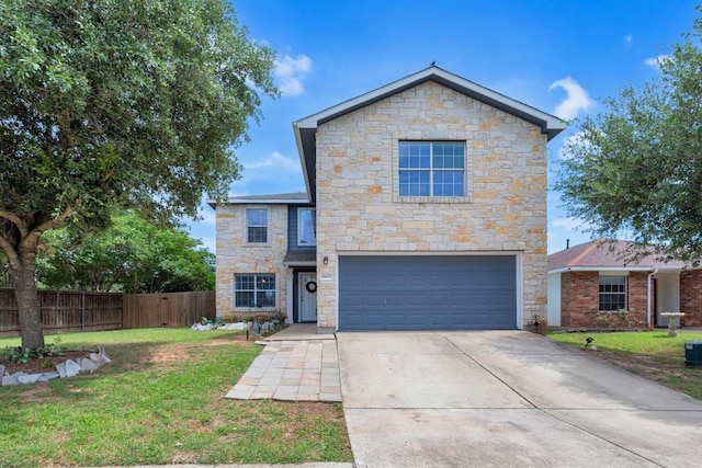 18400 Sun Haven Cv, Elgin, TX 78621 - view of front of house with stone siding, an attached garage, and driveway