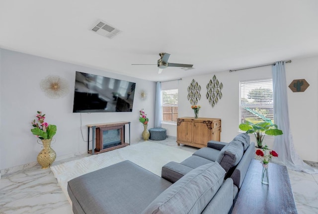 18400 Sun Haven Cv, Elgin, TX 78621 - living area with marble look tiles and a ceiling fan