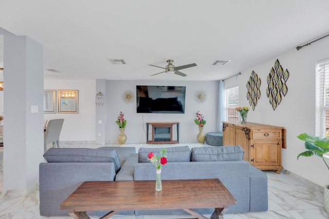 18400 Sun Haven Cv, Elgin, TX 78621 - living room with light marble finish floors and a ceiling fan
