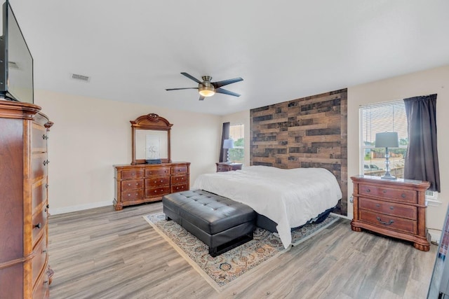 18400 Sun Haven Cv, Elgin, TX 78621 - bedroom with light wood-type flooring, a ceiling fan, and baseboards