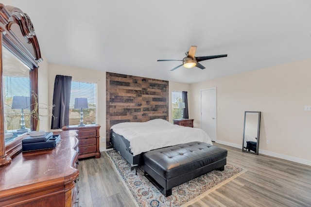 18400 Sun Haven Cv, Elgin, TX 78621 - bedroom with light wood-style floors, baseboards, and ceiling fan