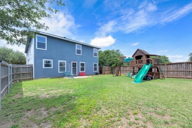 18400 Sun Haven Cv, Elgin, TX 78621 - back of property with a playground