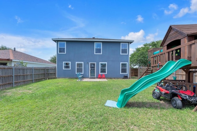 18400 Sun Haven Cv, Elgin, TX 78621 - rear view of property with a playground
