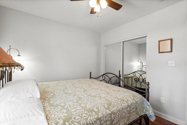 103 Lei Ct, Bastrop, TX 78602 - bedroom featuring wood finished floors, a closet, baseboards, and a ceiling fan