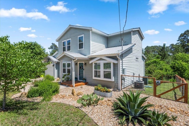 103 Lei Ct, Bastrop, TX 78602 - view of front of house with metal roof, central AC unit, and a standing seam roof