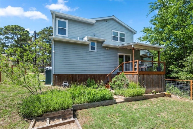103 Lei Ct, Bastrop, TX 78602 - rear view of house with a wooden deck and stairs