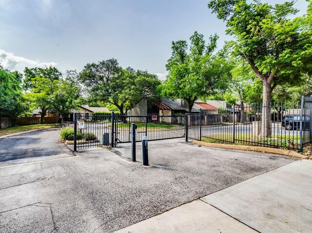 3815 Menchaca Rd Unit 19, Austin, TX 78704 - view of front facade with a gate and a residential view