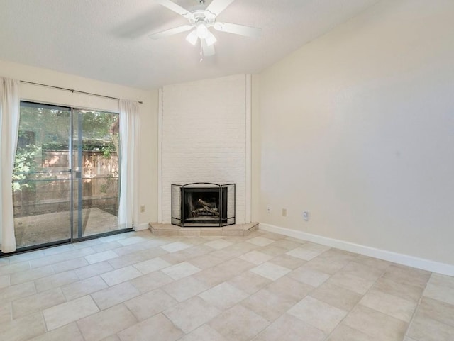 3815 Menchaca Rd Unit 19, Austin, TX 78704 - unfurnished living room with a tile fireplace, ceiling fan, light tile patterned flooring, baseboards, and a textured ceiling