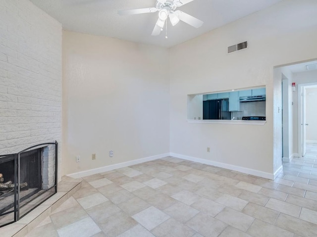 3815 Menchaca Rd Unit 19, Austin, TX 78704 - unfurnished living room with ceiling fan, a brick fireplace, and baseboards