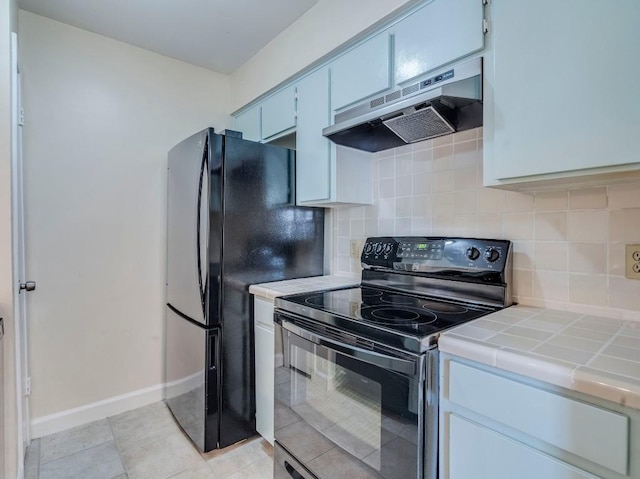 3815 Menchaca Rd Unit 19, Austin, TX 78704 - kitchen featuring black appliances, under cabinet range hood, tile counters, and backsplash