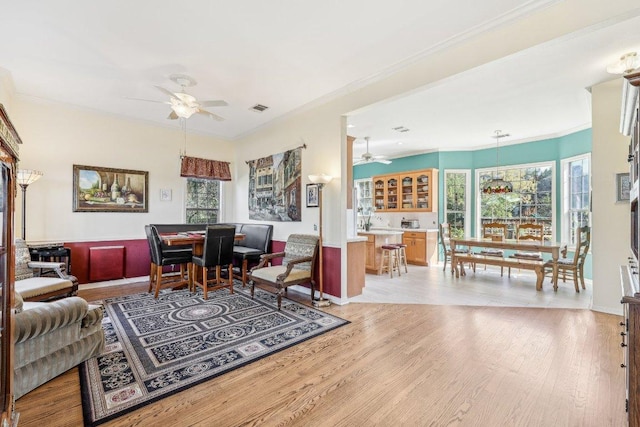 418 Grace Ln, Austin, TX 78746 - living room with a ceiling fan, crown molding, and light wood-type flooring