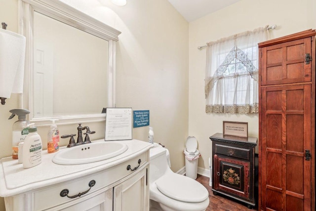 418 Grace Ln, Austin, TX 78746 - half bath with vanity and wood finished floors