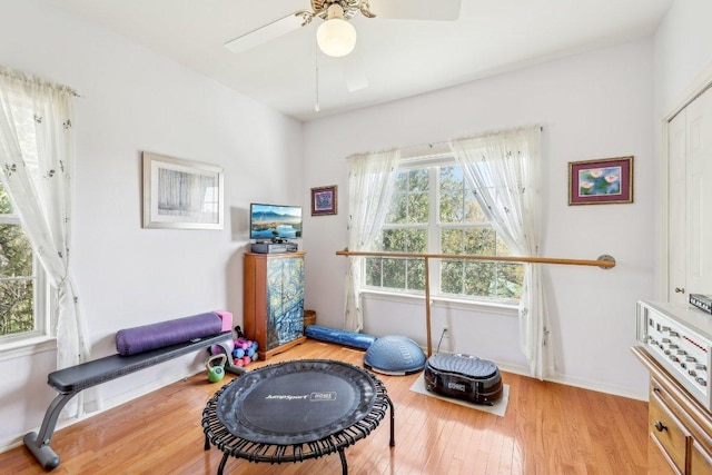 418 Grace Ln, Austin, TX 78746 - workout area featuring wood finished floors and ceiling fan
