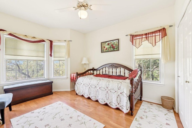 418 Grace Ln, Austin, TX 78746 - bedroom with wood finished floors, a closet, and ceiling fan
