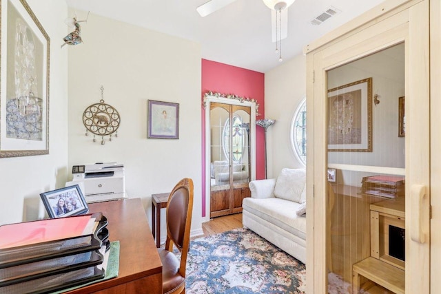 418 Grace Ln, Austin, TX 78746 - home office with a ceiling fan and wood finished floors