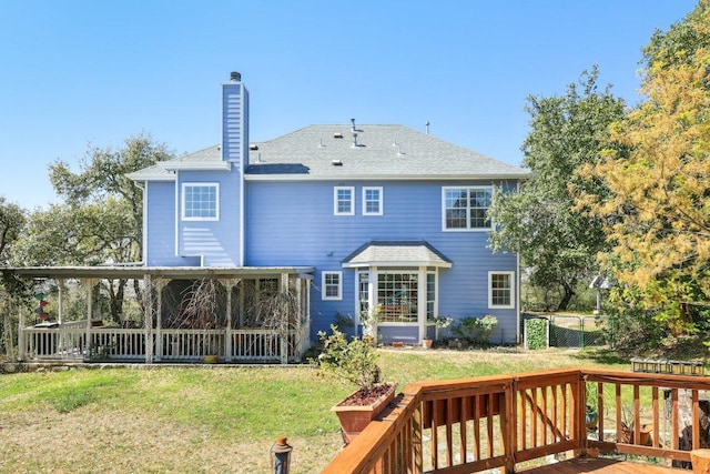 418 Grace Ln, Austin, TX 78746 - rear view of house featuring a chimney, a deck, and a shingled roof