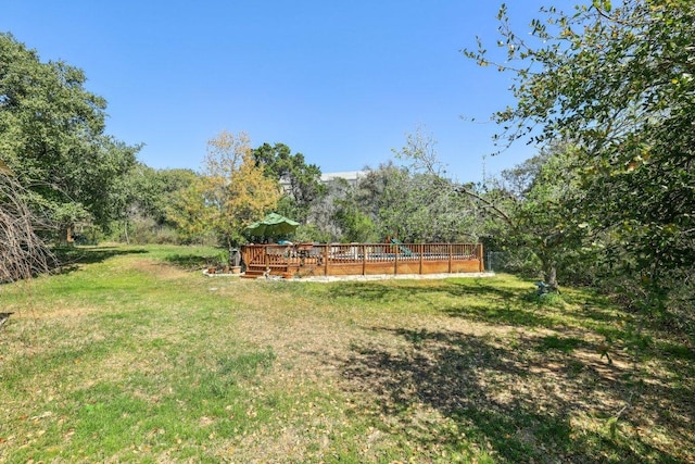418 Grace Ln, Austin, TX 78746 - view of grassy yard with a wooden deck
