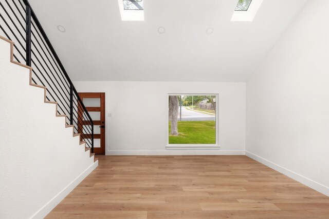 2716 Gettysburg Dr, Austin, TX 78745 - interior space with a skylight, baseboards, wood finished floors, and vaulted ceiling