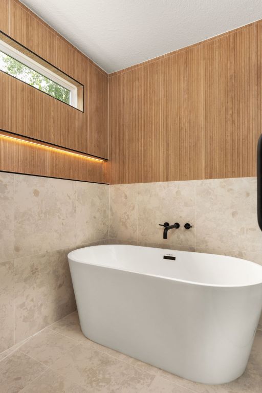 2716 Gettysburg Dr, Austin, TX 78745 - full bath with a freestanding tub and tile patterned floors