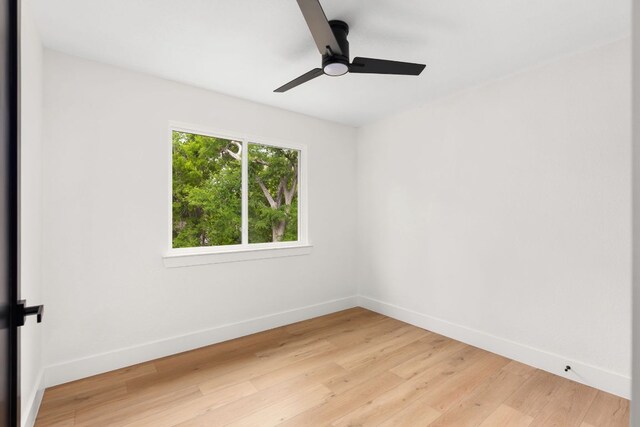 2716 Gettysburg Dr, Austin, TX 78745 - unfurnished room featuring light wood-style floors, baseboards, and a ceiling fan