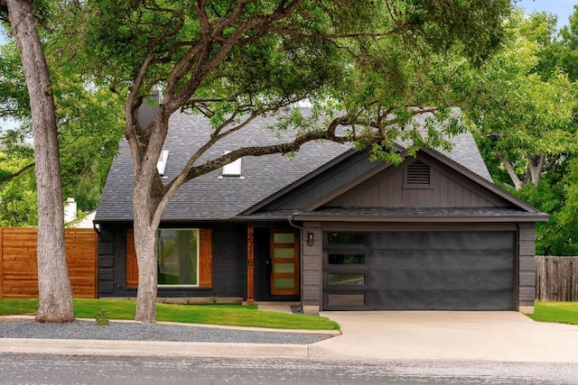2716 Gettysburg Dr, Austin, TX 78745 - view of front facade with a shingled roof, concrete driveway, and an attached garage