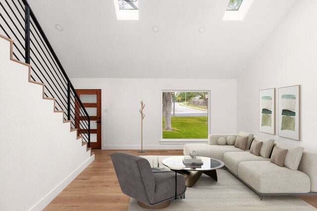 2716 Gettysburg Dr, Austin, TX 78745 - living room with a skylight, stairway, light wood-style flooring, lofted ceiling, and baseboards
