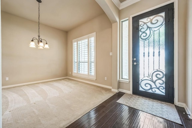 20125 Chayton Cir, Pflugerville, TX 78660 - foyer with arched walkways, a chandelier, and dark wood-style flooring