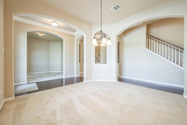 20125 Chayton Cir, Pflugerville, TX 78660 - carpeted spare room with a chandelier, baseboards, arched walkways, and stairs