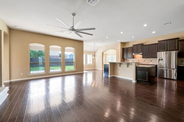 20125 Chayton Cir, Pflugerville, TX 78660 - unfurnished living room featuring a ceiling fan, dark wood-style flooring, recessed lighting, and baseboards