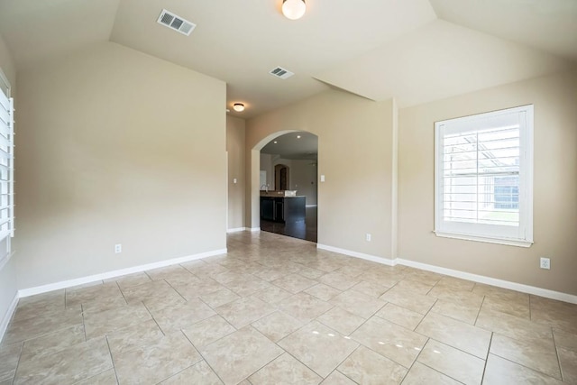 20125 Chayton Cir, Pflugerville, TX 78660 - unfurnished room featuring lofted ceiling, arched walkways, and baseboards