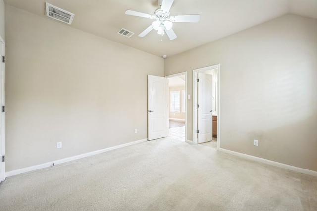 20125 Chayton Cir, Pflugerville, TX 78660 - unfurnished bedroom featuring light colored carpet, baseboards, vaulted ceiling, connected bathroom, and ceiling fan