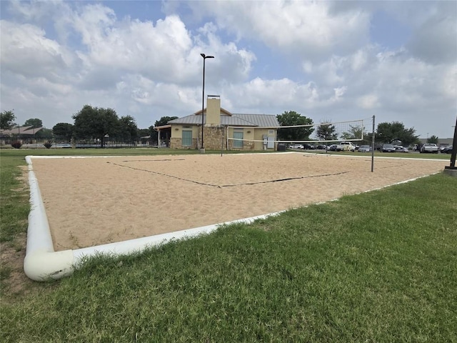 20125 Chayton Cir, Pflugerville, TX 78660 - surrounding community with a lawn and volleyball court