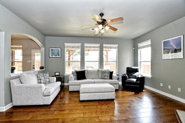 2807 Checker Dr, Cedar Park, TX 78613 - living room with hardwood / wood-style flooring, ceiling fan, arched walkways, and baseboards