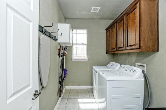 2807 Checker Dr, Cedar Park, TX 78613 - laundry area featuring cabinet space, washer and clothes dryer, baseboards, and light tile patterned floors