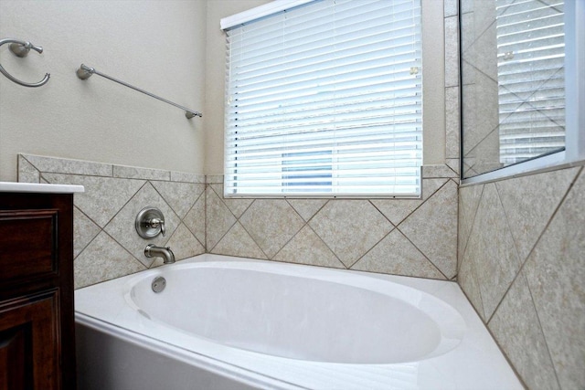 2807 Checker Dr, Cedar Park, TX 78613 - bathroom featuring a bath, vanity, and healthy amount of natural light
