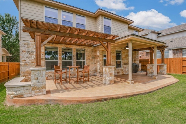 2807 Checker Dr, Cedar Park, TX 78613 - rear view of house with stone siding, ceiling fan, and a patio