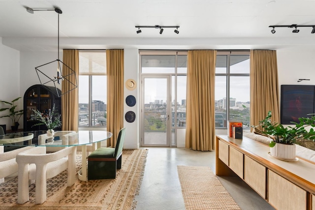 800 W 5th St Unit 902, Austin, TX 78703 - living room with rail lighting, a city view, finished concrete floors, and healthy amount of natural light
