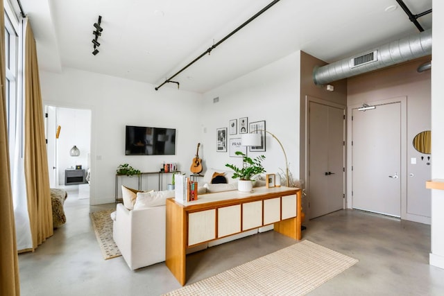 800 W 5th St Unit 902, Austin, TX 78703 - living room with concrete floors and rail lighting