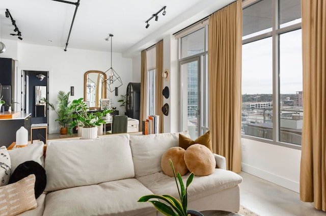 800 W 5th St Unit 902, Austin, TX 78703 - living room featuring track lighting and baseboards